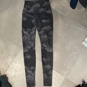 Rare Lululemon Grey and Black Rose Patterned Leggings. Fit like a size four.